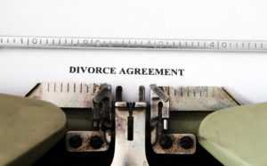 typewriter typing divorce agreement after collaborative divorce
